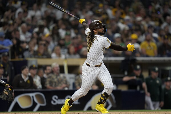 San Diego Padres' Fernando Tatis Jr. watches his home run during the fifth inning of a baseball game against the Oakland Athletics, Monday, June 10, 2024, in San Diego. (AP Photo/Gregory Bull)