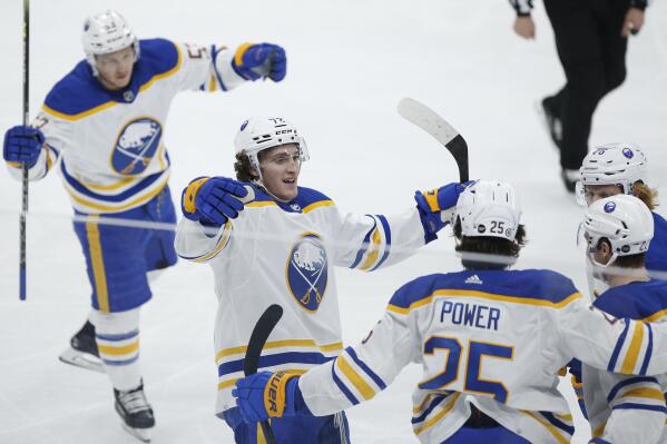 Buffalo Sabres' Jeff Skinner (53), Tage Thompson (72), Owen Power (25), Jack Quinn (22) and Rasmus Dahlin (26) celebrate Power's goal against the Winnipeg Jets during the second period of an NHL hockey game Thursday, Jan. 26, 2023, in Winnipeg, Manitoba. (John Woods/The Canadian Press via AP)