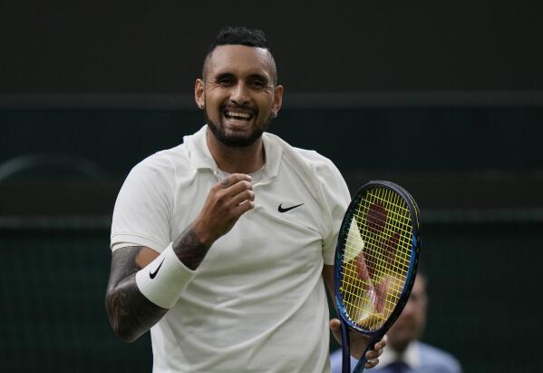 Australia's Nick Kyrgios smiles during the men's singles first round match against Ugo Humbert of France on day two of the Wimbledon Tennis Championships in London, Tuesday June 29, 2021. (AP Photo/Alastair Grant)