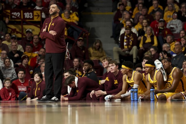 Minnesota head coach Ben Johnson looks to the scoreboard during the first half of an NCAA college basketball game against Wisconsin, Wednesday, March 5, 2025, in Minneapolis. (AP Photo/Ellen Schmidt, File)