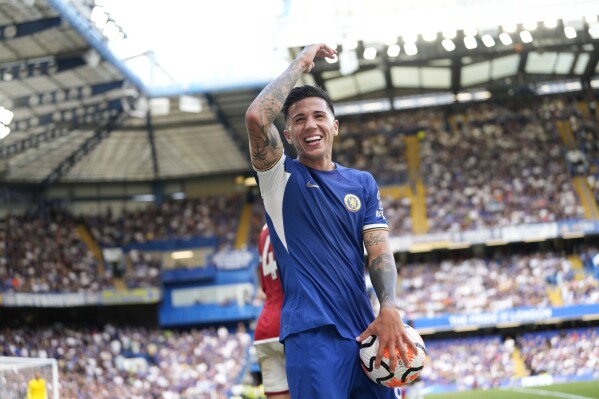 Chelsea's Enzo Fernandez smiles during the English Premier League soccer match between Chelsea and Nottingham Forest at Stamford Bridge stadium in London, Saturday, Sept. 2, 2023. (AP Photo/Kirsty Wigglesworth)