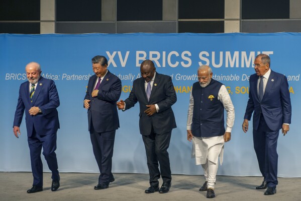 FILE- From left, Brazil's President Luiz Inacio Lula da Silva, China's President Xi Jinping, South Africa's President Cyril Ramaphosa, India's Prime Minister Narendra Modi and Russia's Foreign Minister Sergei Lavrov pose for a BRICS group photo during the 2023 BRICS Summit in Johannesburg, South Africa, Aug. 23, 2023. Modi says his country is “becoming the voice of the Global South,” and that at the upcoming Group of 20 meetings being held in New Delhi that voice will be heard. At the recent summit of the BRICS nations _ current chair South Africa declared that the grouping's goal was to "seek is to advance the agenda of the Global South.”(Alet Pretorius/Pool Photo via AP, File)