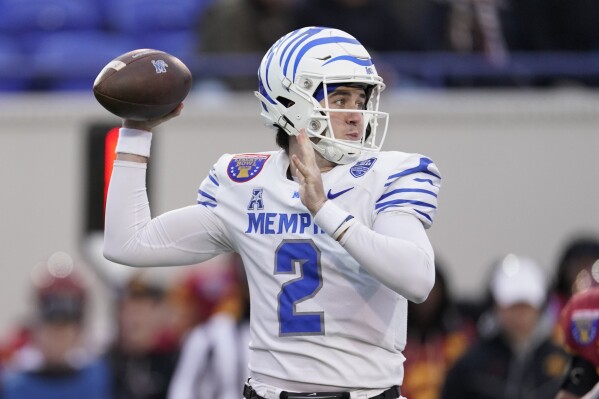Memphis quarterback Seth Henigan (2) looks to throw a pass during the first half of the Liberty Bowl NCAA college football game against Iowa State, Friday, Dec. 29, 2023, in Memphis, Tenn. (AP Photo/George Walker IV)