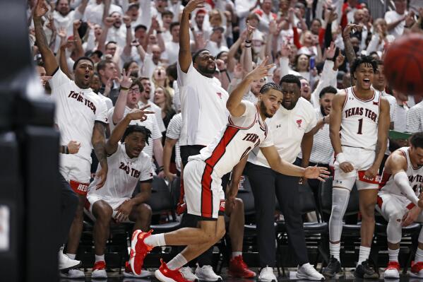Texas Tech's Kevin Obanor (0) celebrates after scoring a 3-point shot during the second half of an NCAA college basketball game against Baylor, Wednesday, Feb. 16, 2022, in Lubbock, Texas. (AP Photo/Brad Tollefson)