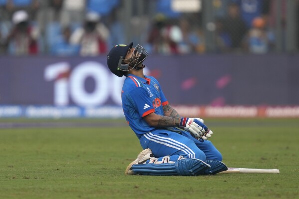 India's Virat Kohli celebrates his century during the ICC Men's Cricket World Cup first semifinal match between India and New Zealand in Mumbai, India, Wednesday, Nov. 15, 2023. (AP Photo/Rafiq Maqbool)