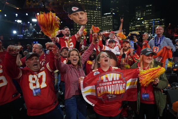 Kansas City Chiefs fans cheer during the first round of the NFL football draft, Thursday, April 25, 2024, in Detroit. (AP Photo/Paul Sancya)
