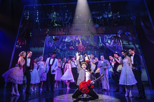 This image released by Polk & Co. shows Casey Likes, center, and the cast during a performance of 