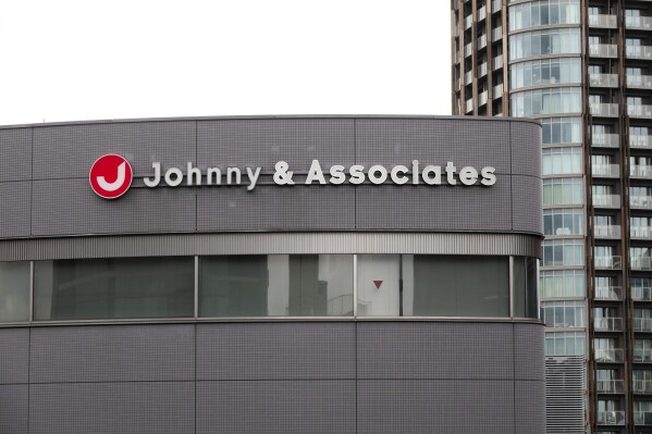 FILE - A sign hangs on the facade of the headquarters of Johnny & Associates talent agency founded by Johnny Kitagawa in Tokyo, on July 10, 2019. A group working under the U.N. Human Rights Council has issued a wide-ranging report about rights in Japan, including discrimination against minorities and unhealthy working conditions. Among the issues raised in the report was alleged sexual abuse at the Japanese entertainment company formerly known as Johnny and Associates. (AP Photo/Jae C. Hong, File)
