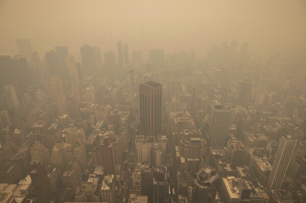 FILE - Haze from wildfires in Canada is visible in New York City from the Empire State Building observatory, June 7, 2023, in New York. (AP Photo/Yuki Iwamura, File)