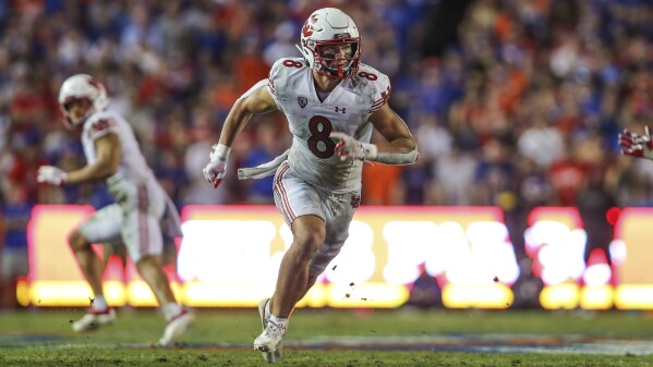 FILE - Utah safety Cole Bishop (8) plays during an NCAA football game against Florida on Saturday, Sept. 3, 2022 in Gainesville, Fla. Utah opens their season at home against Florida on Aug. 31. (AP Photo/Gary McCullough, File)