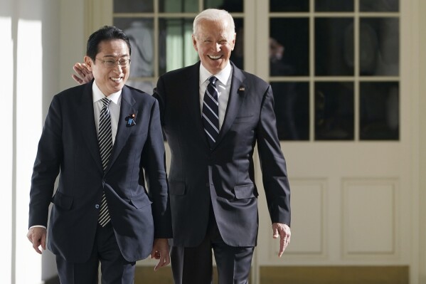 FILE - President Joe Biden and Japanese Prime Minister Fumio Kishida walk along the Colonnade of the White House, Jan. 13, 2023, in Washington. Biden will host Kishida for a state visit on April 10, with the goal of strengthening a critical alliance as the United States has sought to counter China's influence in the Indo Pacific region. (Mandel Ngan/Pool Photo via AP, File)