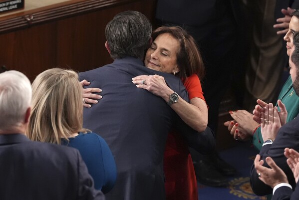Rep. Lisa McClain, R-Mich., right, congratulates House Speaker Mike Johnson, R-La., upon Johnson's re-election as the House of Representatives meets to elect a speaker and convene the new 119th Congress at the Capitol in Washington, Friday, Jan. 3, 2025. (AP Photo/Jacquelyn Martin)