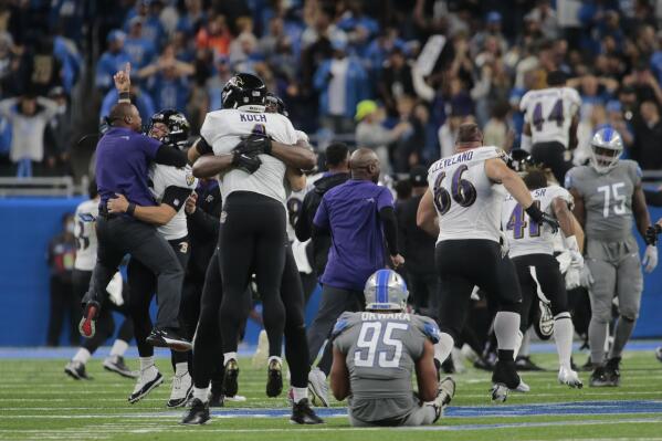 Baltimore Ravens players celebrate a Justin Tucker 66-yard field goal as Detroit Lions linebacker Romeo Okwara (95) sits on the field in the second half of an NFL football game against the Detroit Lions in Detroit, Sunday, Sept. 26, 2021. Baltimore won 19-17. (AP Photo/Tony Ding)