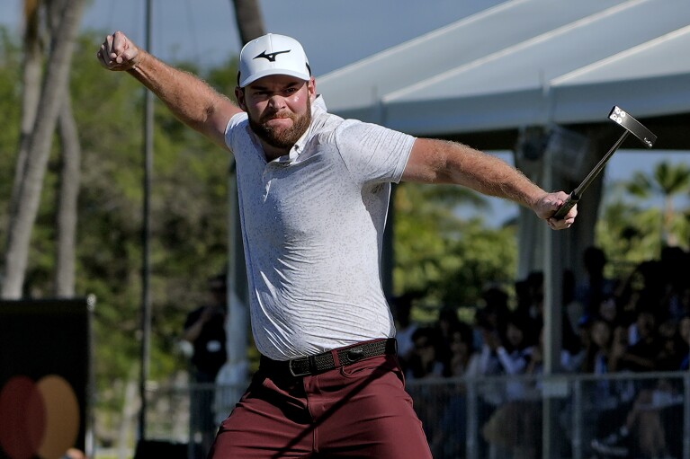 FILE - Grayson Murray celebrates winning the Sony Open golf tournament at Waialea Country Club in Honolulu, Sunday, Jan. 14, 2024.  Two-time PGA Tour winner Grayson Murray died at the age of 30 on Saturday morning, May 25, 2024, a day after withdrawing from the Charles Schwab Cup Challenge at Colonial.  (AP Photo/Matt York, File)