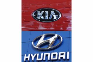 FILE- This combination of file photos shows the logo of Kia Motors Dec. 13, 2017, in Seoul, South Korea, top, and Hyundai logo April 15, 2018, in the south Denver suburb of Littleton, Colo., bottom. Hyundai and Kia are telling the owners of nearly 485,000 vehicles in the U.S., Tuesday, Feb. 8, 2022, to park them outdoors because they can catch fire. (AP Photo, File)