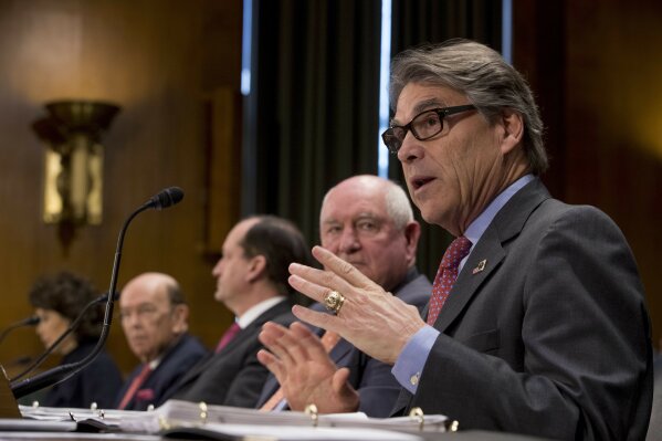 
              From left, Transportation Secretary Elaine Chao, Commerce Secretary Wilbur Ross, Labor Secretary Alex Acosta, Agriculture Secretary Sonny Perdue, and Energy Secretary Rick Perry appear before a Senate Committee on Commerce, Science, & Transportation hearing on infrastructure on Capitol Hill in Washington, Wednesday, March 14, 2018. (AP Photo/Andrew Harnik)
            
