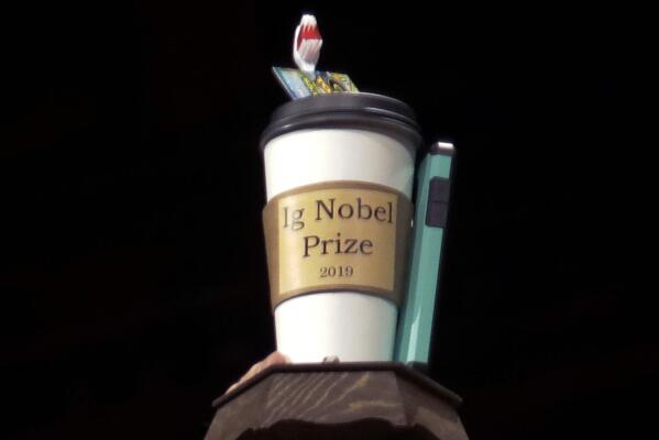 FILE - In this Sept. 12, 2019 file photo, the 2019 Ig Nobel award is displayed at the 29th annual Ig Nobel awards ceremony at Harvard University in Cambridge, Mass. The spoof prizes for weird and sometimes head-scratching scientific achievement will be presented online in 2021 due to the coronavirus pandemic. (AP Photo/Elise Amendola, File)