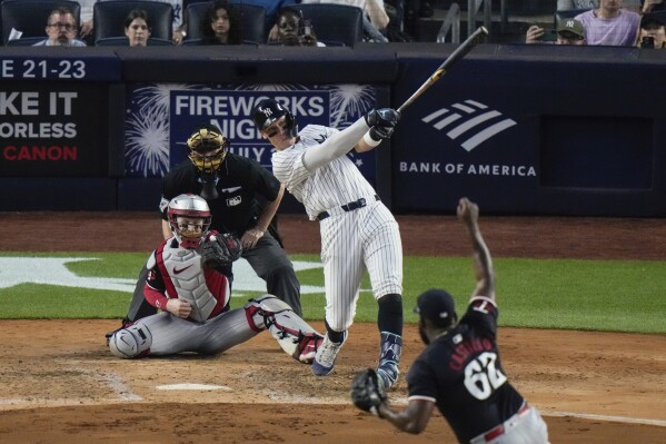 New York Yankees' Aaron Judge follows through on a two-run triple against the Minnesota Twins during the fifth inning of a baseball game Wednesday, June 5, 2024, in New York. (AP Photo/Frank Franklin II)