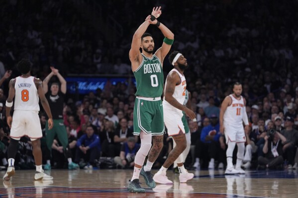 Boston Celtics' Jayson Tatum reacts after shooting a 3-point basket during the first half of Game 3 of an NBA basketball second-round playoff series against the New York Knicks, Saturday, May 10, 2025, in New York. (AP Photo/Pamela Smith)