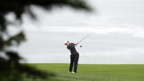 Xiyu Janet Lin, of China, hits from the fairway on the 11th hole during the first round of the U.S. Women's Open golf tournament at the Pebble Beach Golf Links, Thursday, July 6, 2023, in Pebble Beach, Calif. (AP Photo/Godofredo A. Vásquez)