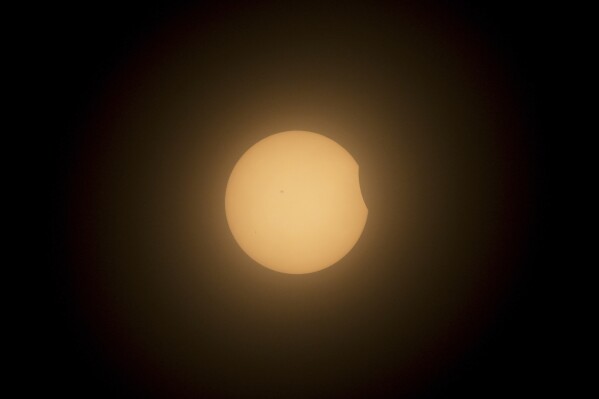 The moon partially covers the sun during a total solar eclipse in Mazatlan, Mexico, Monday, April 8, 2024. (AP Photo/Fernando Llano)