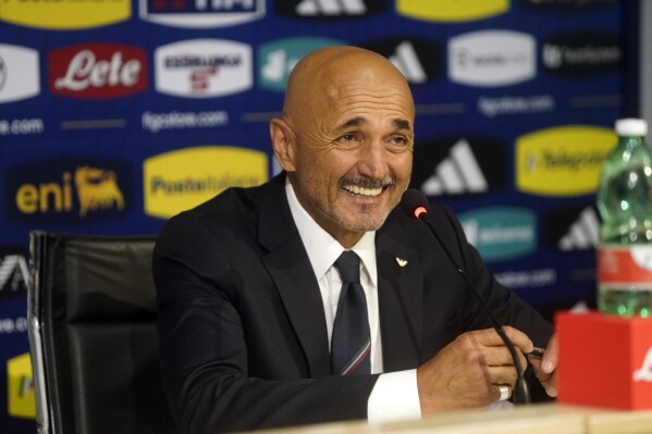 Luciano Spalletti speaks to the media during his presentation as the new Italian national team coach, in Florence, Italy, Saturday, Sept. 2, 2023. New national team coach Luciano Spalletti says he will carry an Italian flag that his mom made for him when he was 11 onto the Azzurri bench. The former Napoli coach was hired when Roberto Mancini unexpectedly resigned last month. (Alessandro La Rocca/LaPresse via AP)