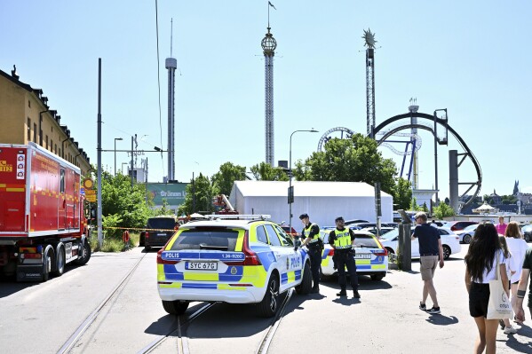 Police cordon off the Gröna Lund amusement park in Stockholm, Sunday, June 25, 2023. According to reports an accident occurred on a rollercoaster leaving one person dead. The amusement park was being evacuated and the police have set up cordons. (Claudio Bresciani/TT News Agency via AP)