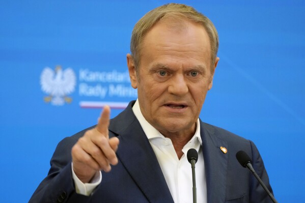 Poland's Prime Minister Donald Tusk speaks during a news conference to communicate that a special commission tasked with investigating Russian and Belarusian influence in Poland in 2004-2024 was beginning its work, in Warsaw, Poland, Wednesday, June 5, 2024. The commission composed of non-partisan security and media experts is to analyse cases of suspected foreign activity at a time of security concerns across Europe. (AP Photo/Czarek Sokolowski)