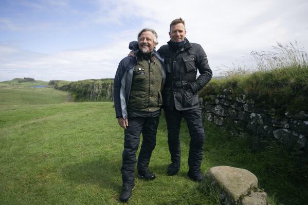 This image released by Apple TV+ shows Charley Boorman, left, and Ewan McGregor in a scene from "Long Way Home." (Max Cruz/Apple TV+ via AP)
