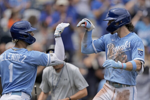 Kansas City Royals' Bobby Witt Jr. (7) celebrates with MJ Melendez (1) after hitting a two-run home run during the third inning of a baseball game against the New York Mets Thursday, Aug. 3, 2023, in Kansas City, Mo. (AP Photo/Charlie Riedel)