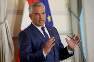 Austrian Chancellor Karl Nehammer attends a press conference in Vienna on Thursday, Aug. 8, 2024. (AP Photo/Heinz-Peter Bader, File)