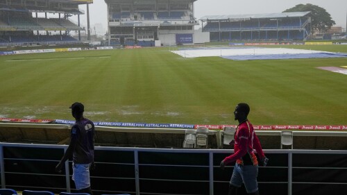 The covers are out as rain delays the start of play on day five of the second cricket Test match between India and West Indies at Queen's Park in Port of Spain, Trinidad and Tobago, Monday, July 24, 2023. (AP Photo/Ricardo Mazalan)