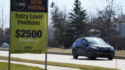 File - A hiring sign is shown in Wheeling, Ill., Sunday, March 19, 2023. On Thursday, the Labor Department reports on the number of people who applied for unemployment benefits last week. (AP Photo/Nam Y. Huh, File)
