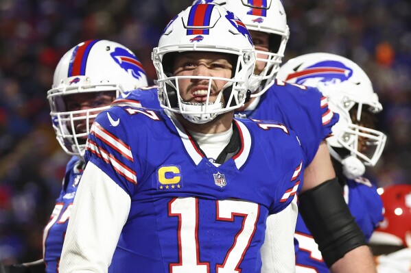 Buffalo Bills quarterback Josh Allen (17) reacts after scoring a touchdown against the Kansas City Chiefs during the second quarter of an NFL AFC division playoff football game, Sunday, Jan. 21, 2024, in Orchard Park, N.Y. (AP Photo/Jeffrey T. Barnes)