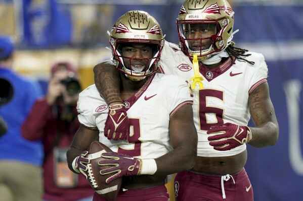Florida state running back Trey Benson (3) celebrates after a touchdown with tight end Jaheim Bell (6) during the second half of an NCAA college football game against Pittsburgh in Pittsburgh, Saturday, Nov. 4, 2023. (AP Photo/Matt Freed)