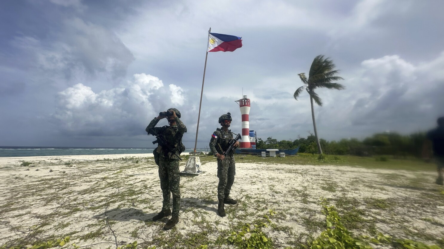Philippine-held island in disputed South China Sea sits in Beijing's shadow