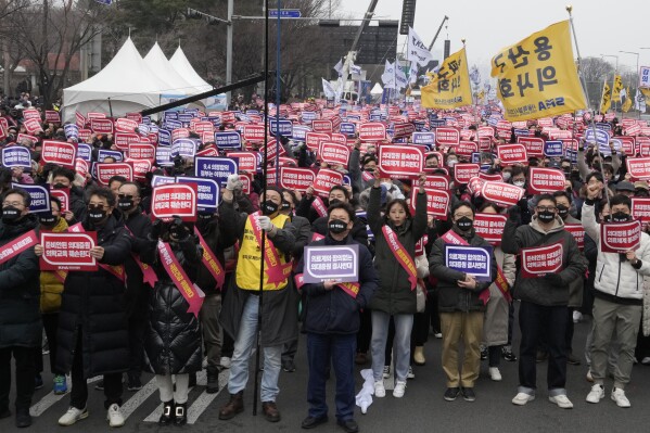 Doctors stage a rally against the government's medical policy in Seoul, South Korea, Sunday, March 3, 2024. Thousands of senior doctors rallied in Seoul on Sunday to express their support for junior doctors who have been on strike for nearly two weeks over a government plan to sharply increase the number of medical school admissions. (AP Photo/Ahn Young-joon)