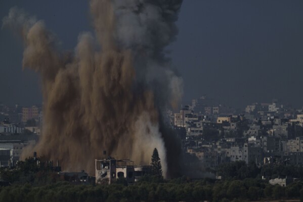 An Israeli airstrike in the Gaza Strip is seen from southern Israel, Friday, Nov. 10, 2023. (AP Photo/Leo Correa)