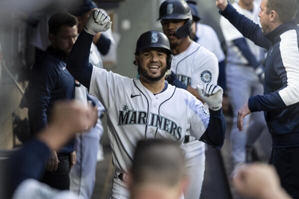 Seattle Mariners' Eugenio Suarez celebrates after hitting a two-run home run off Minnesota Twins starting pitcher Joe Ryan during the fourth inning of a baseball game Tuesday, June 14, 2022, in Seattle. (AP Photo/Stephen Brashear)