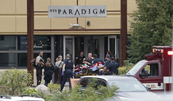 
              Emergency personnel arrive on the scene of a shooting at a software company in Middleton, Wis., Wednesday, Sept. 19, 2018.    Four people were shot and wounded during the shooting in the suburb of Madison, according to a city administrator.  (Steve Apps/Wisconsin State Journal via AP)
            