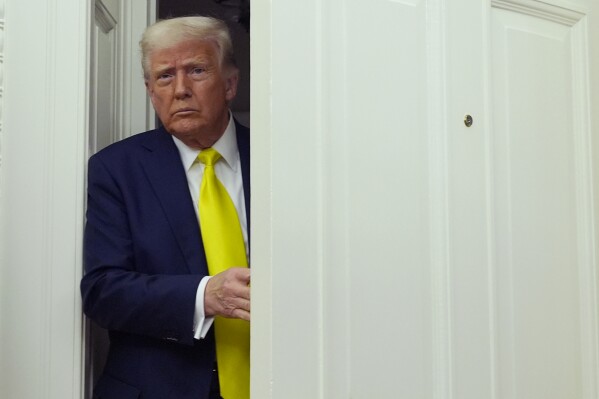 President Donald Trump arrives at a swearing in ceremony for Dr. Mehmet Oz to be Administrator of the Centers for Medicare and Medicaid Services, in the Oval Office of the White House, Friday, April 18, 2025, in Washington. (AP Photo/Alex Brandon)