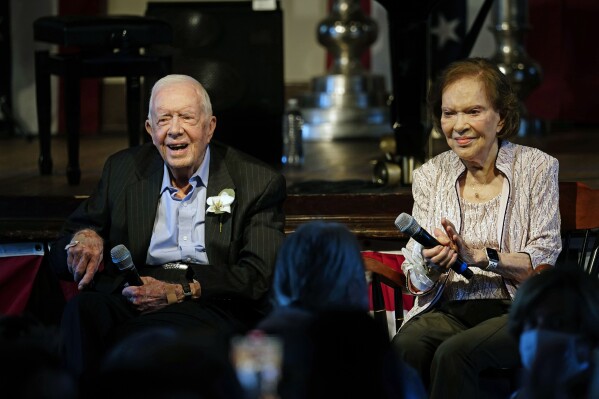 FILE - Former U.S. President Jimmy Carter and his wife, former first lady Rosalynn Carter, sit together during a reception to celebrate their 75th wedding anniversary, July 10, 2021, in Plains, Ga. Rosalynn Carter, the closest adviser to Jimmy Carter during his one term as U.S. president and their four decades thereafter as global humanitarians, died Sunday, Nov. 19, 2023. She was 96. (AP Photo/John Bazemore, Pool, File)