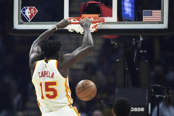 Atlanta Hawks' Clint Capela dunks during the first half of the team's NBA play-in basketball game against the Cleveland Cavaliers Friday, April 15, 2022, in Cleveland. (AP Photo/Nick Cammett)