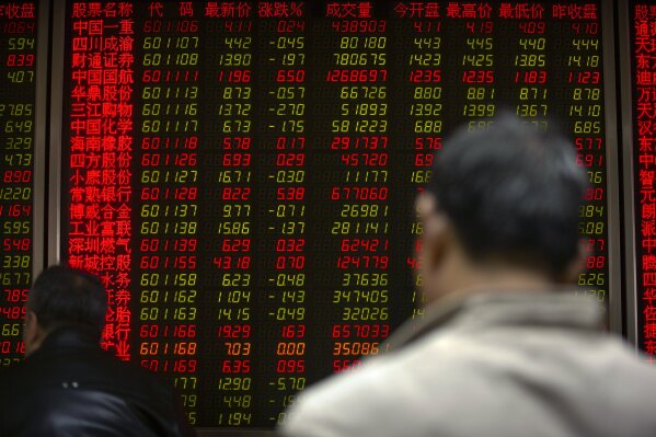 
              Chinese investors monitor stock prices at a brokerage house in Beijing, Thursday, April 4, 2019. Shares were mixed in Asia on Thursday after modest gains overnight on Wall Street.(AP Photo/Mark Schiefelbein)
            