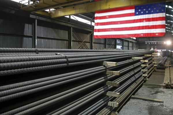 FILE - In this May 9, 2019, photo, steel rods produced at the Gerdau Ameristeel mill in St. Paul, Minn. await shipment. The United States and the United Kingdom have agreed to begin talks on removing former President Donald Trump's import taxes on British steel and aluminum. In a joint statement Wednesday, Jan. 19, 2022 U.S. Commerce Secretary Gina Raimondo, U.S. Trade Representative Katherine Tai and U.K. Trade Minister Anne-Marie Tevelyan said they would be working toward a swift deal that ensures the viability of the steel and aluminum industries in both countries and also “strengthens their democratic alliance.'' (AP Photo/Jim Mone, File)