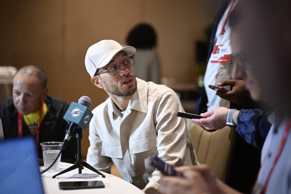 Miami Dolphins head coach Mike McDaniel talks with reporters during an AFC coaches availability at the NFL owners meetings, Monday, March 25, 2024, in Orlando, Fla. (AP Photo/Phelan M. Ebenhack)