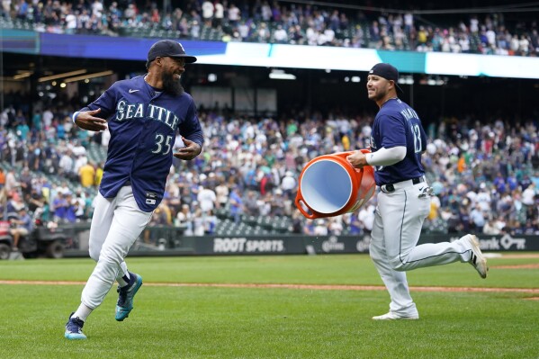 American League's Julio Rodríguez, of the Seattle Mariners, jogs off the  field during the MLB All-Star baseball game against the National League in  Seattle, Tuesday, July 11, 2023. (AP Photo/Lindsey Wasson Stock