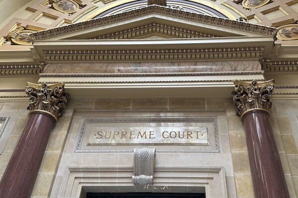 FILE - The entrance to the Wisconsin Supreme Court chambers is seen inside the state Capitol in Madison, Wis., March 14, 2024. The state Supreme Court announced Friday, May 3, that it will decide whether mobile voting sites are legal without allowing any lower appellate courts to rule first. (AP Photo/Todd Richmond, File)