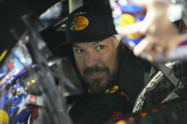 Martin Truex Jr., in his car, prepares for the start of the first of two NASCAR Daytona 500 qualifying auto races at Daytona International Speedway, Thursday, Feb. 13, 2025, in Daytona Beach, Fla. (AP Photo/John Raoux)