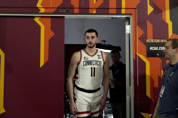 UConn forward Alex Karaban exits the interview room ahead of a Final Four college basketball game in the NCAA Tournament, Thursday, April 4, 2024, in Glendale, Ariz. UConn will face Alabama on Saturday. (AP Photo/Brynn Anderson )